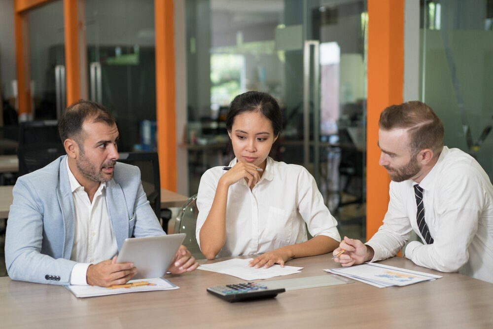 Marketing analysts reviewing a website's metrics in a Mexico City office