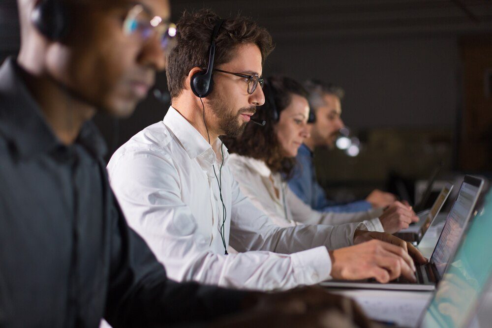 Call center operator talking with a client