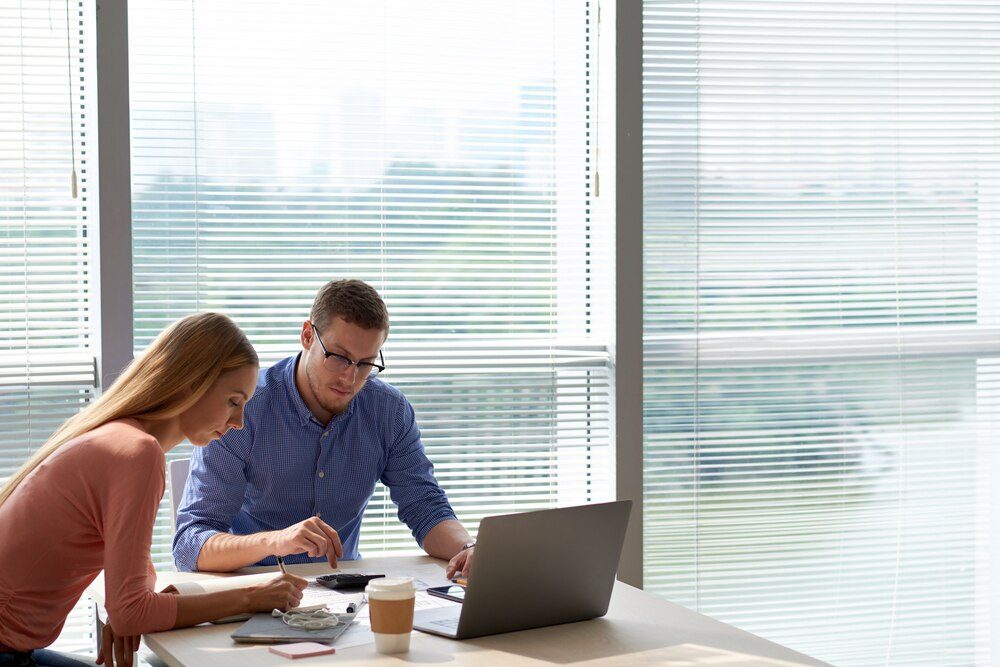 A team reviewing data on a laptop