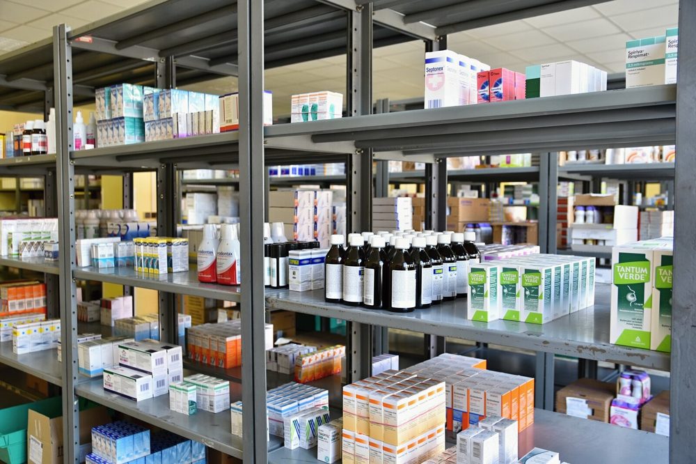 Shelf with organized medicine boxes