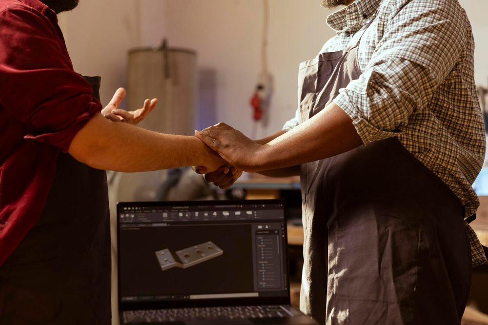 Two people closing a work agreement