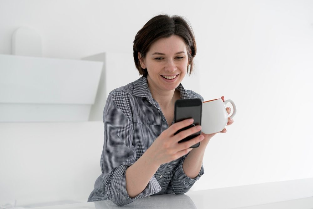 Person consulting a chatbot from their phone