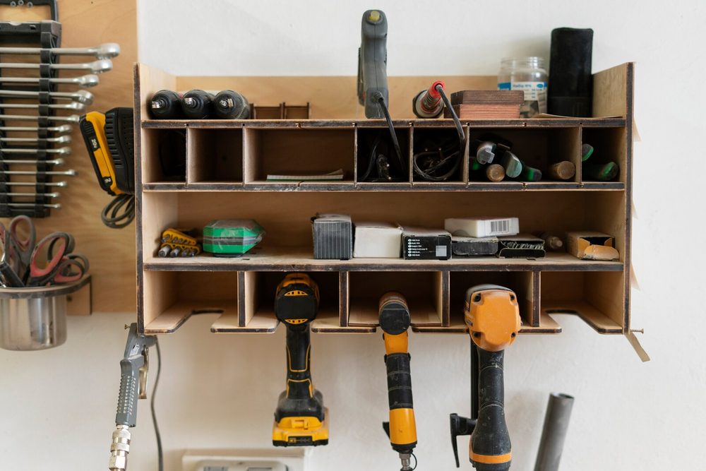 Hardware store shelves with tools and materials organised by reference