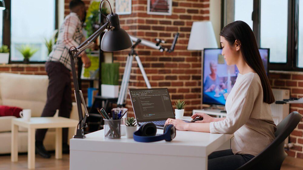 Software developer writing code in a cozy home office